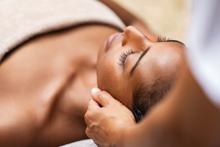 African American woman receiving a massage at Skin Bar VII in Detroit, MI